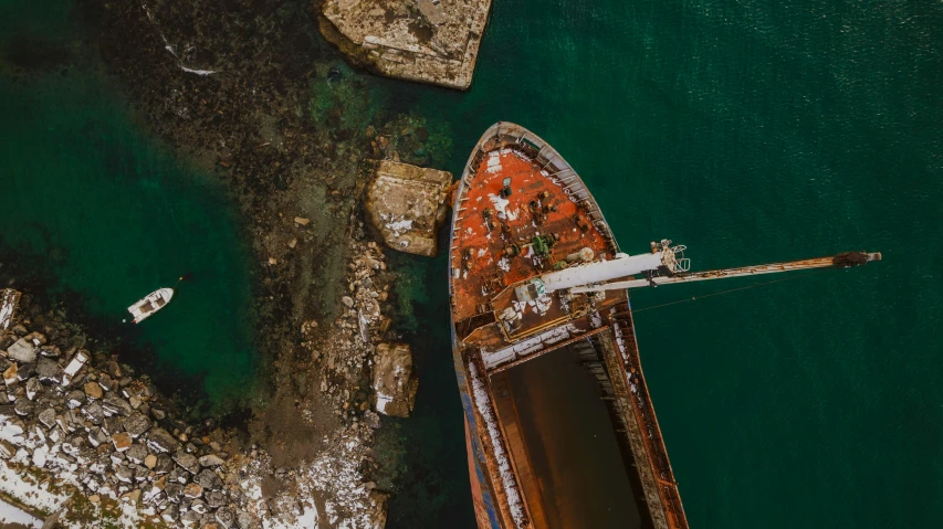 two boats are parked next to a dock