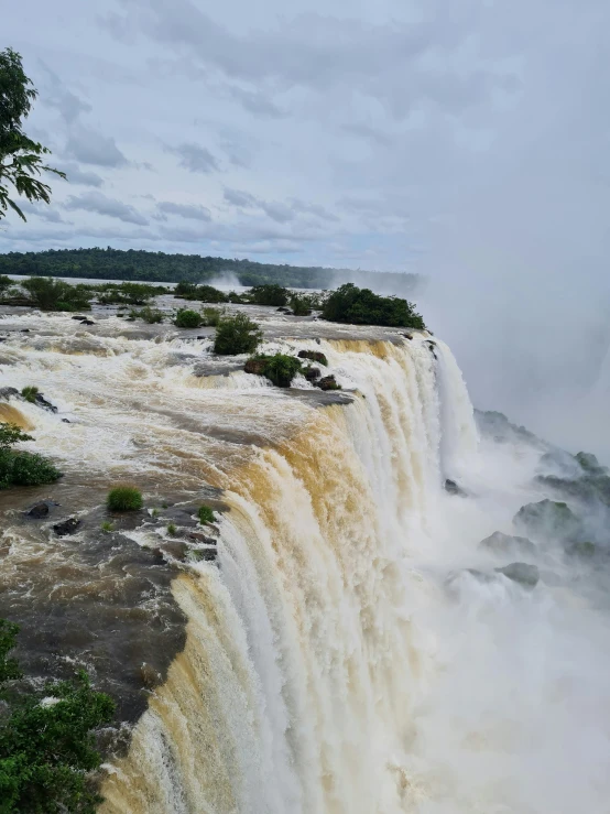 water falls are pouring into a huge waterfall