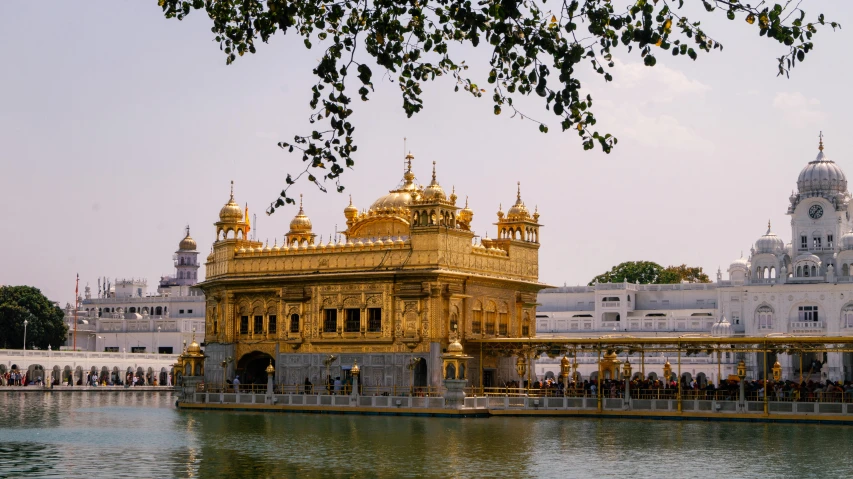 a boat on a body of water near a gold colored building