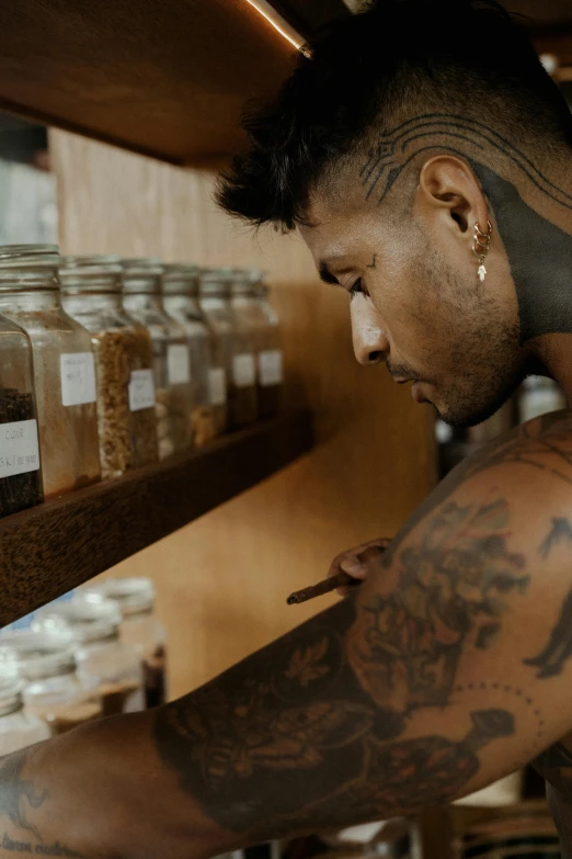 a man is working on some food at the counter