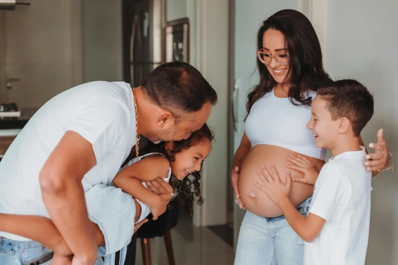 a woman is holding the baby on her lap