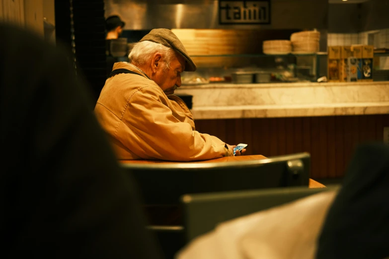 a person sitting in a chair in front of a counter