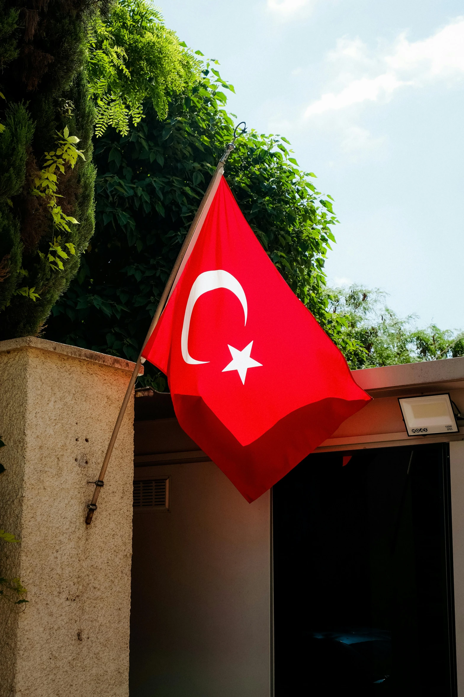 a large turkey flag on top of a building