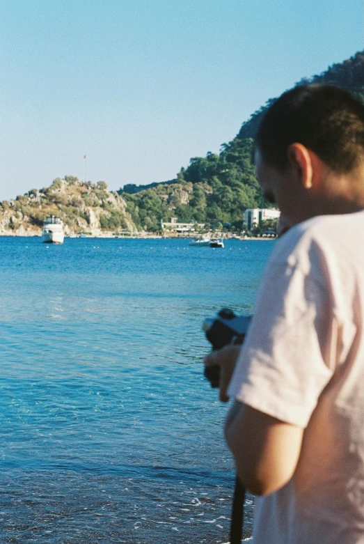 there is a man that is taking pictures of the water