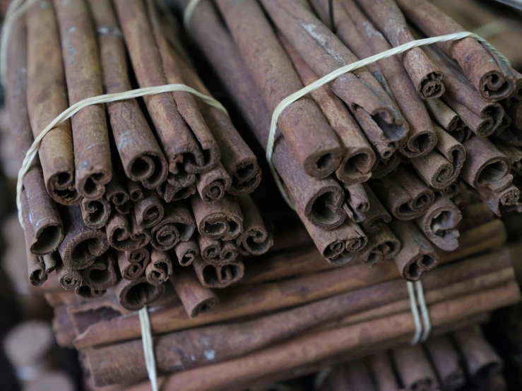 cinnamon sticks stacked up and labeled with a message