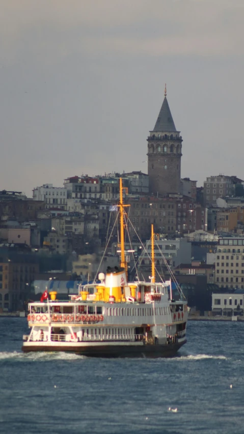 the boat is heading down the river through the city