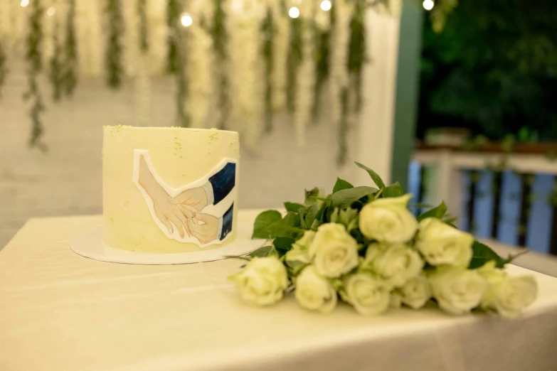 a table with a small white cake on it