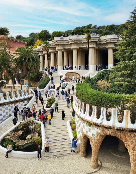 many people are walking up steps to a building