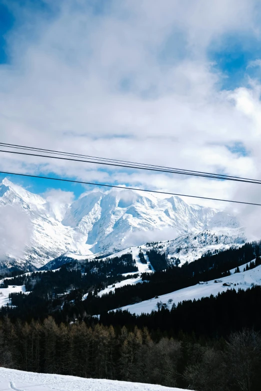 two people riding skis on a snowy surface