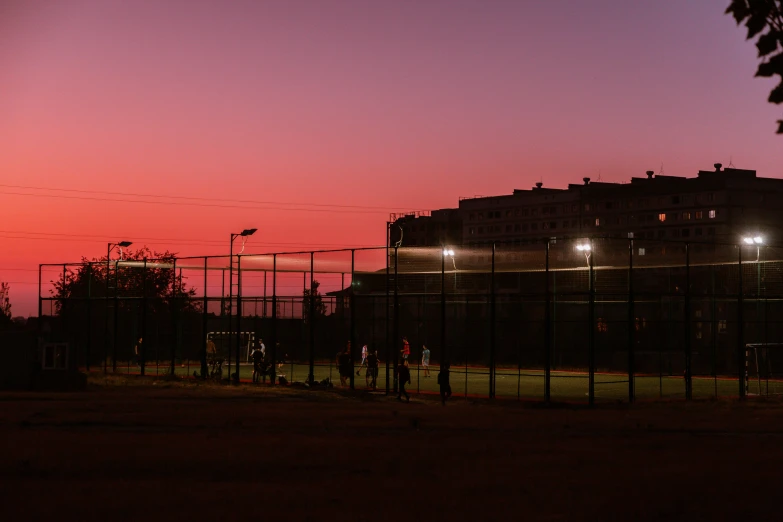 fence and lights near a parking lot area