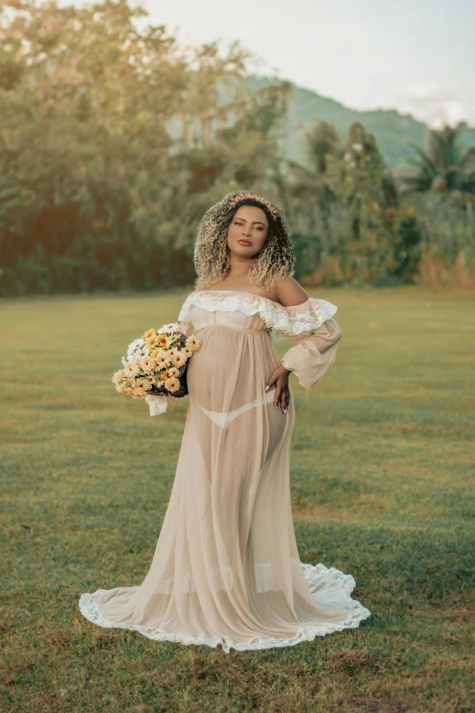 a woman wearing a wedding dress standing in the grass
