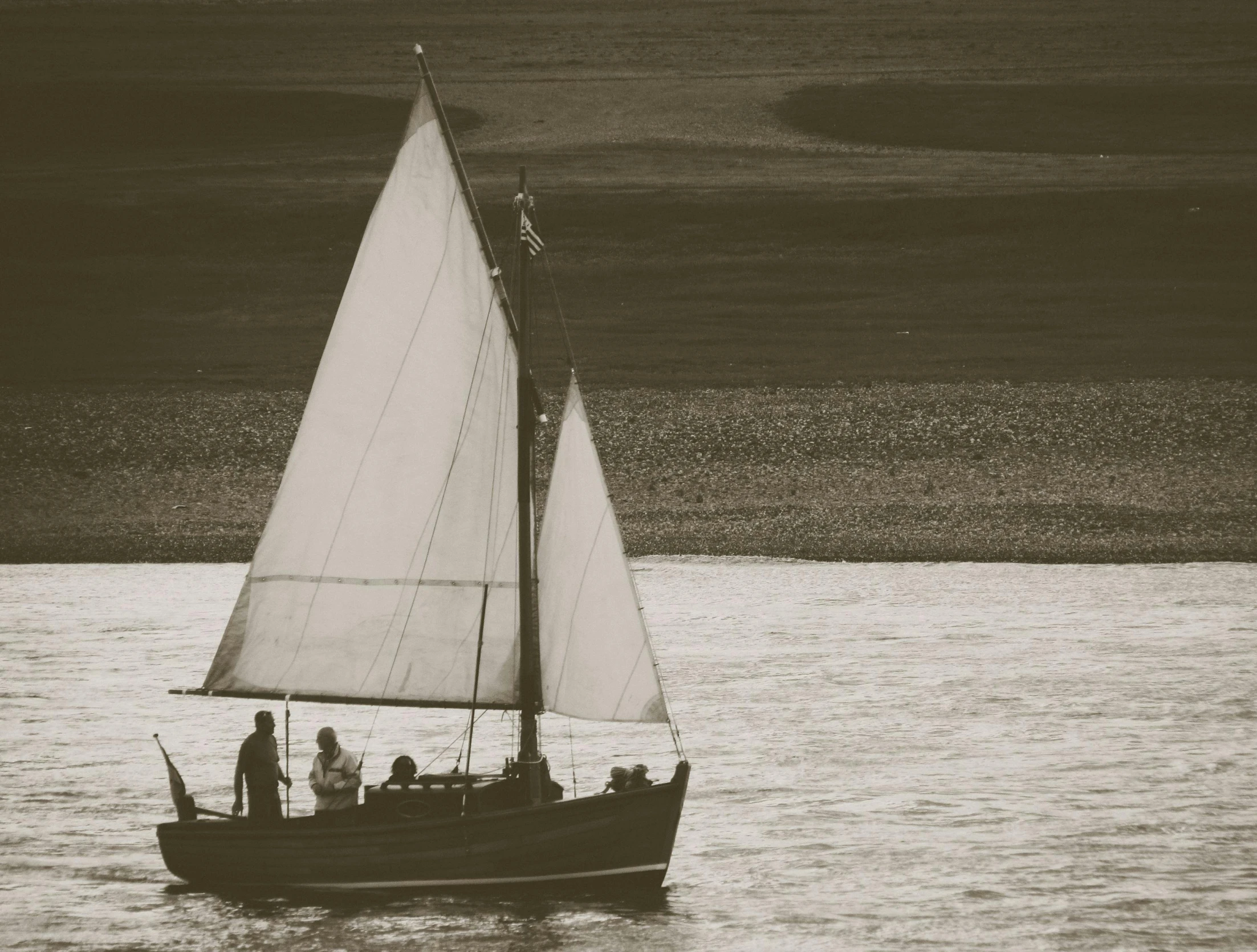 a black and white po of a sailboat