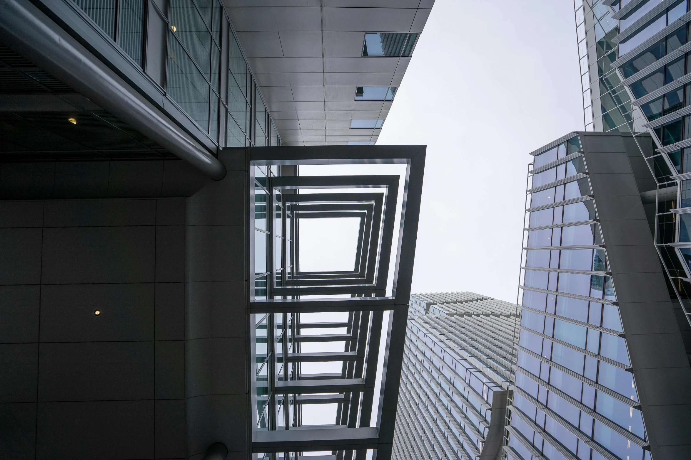 an aerial view of tall buildings from between the building