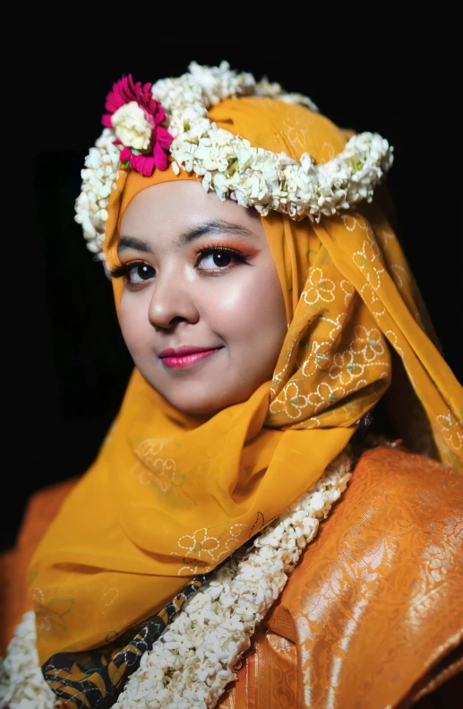 an asian woman in traditional attire smiles