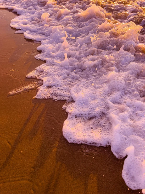 waves on the beach crashing on the sand