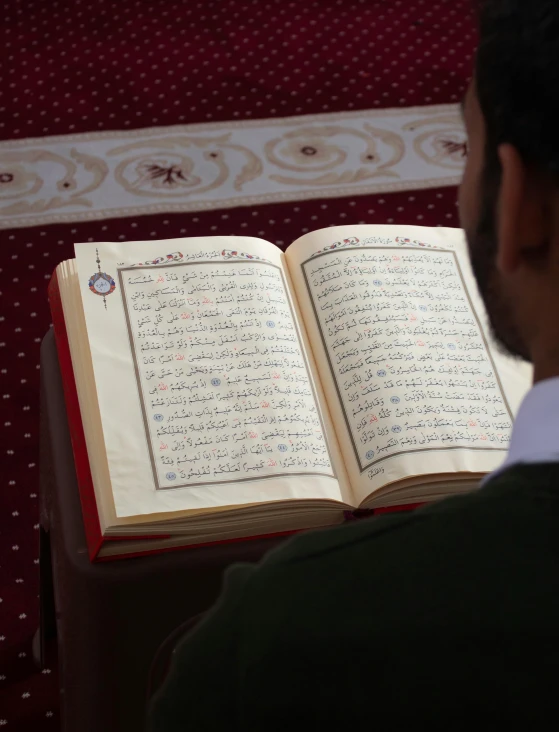 a man reading the holy book from the book of the habab