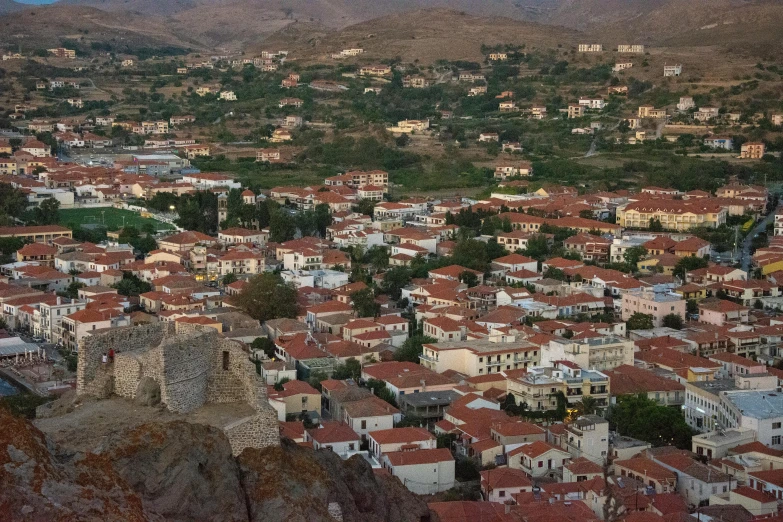 a panoramic s of a city with hills in the background