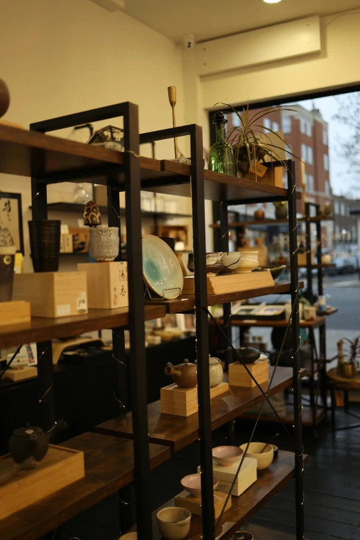 a room with shelves of plates and bowls on display