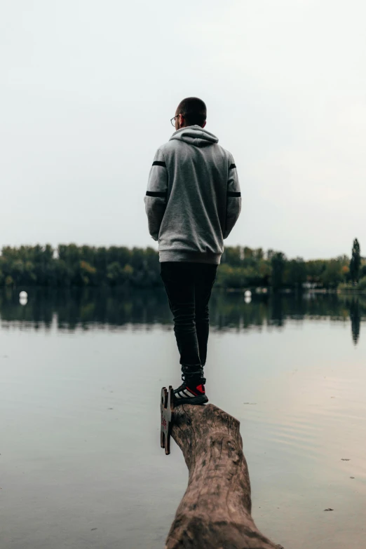 a man walking across a body of water