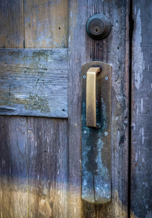 a door handle on a old wooden building