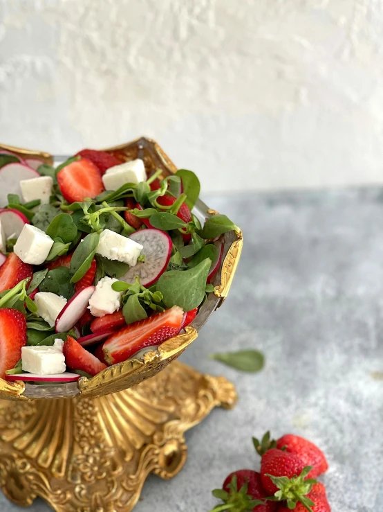 a fancy dessert plate with a strawberry salad