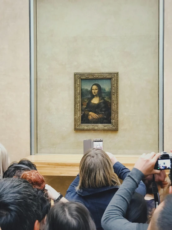 people taking pictures of a renaissance artwork with their cellphones