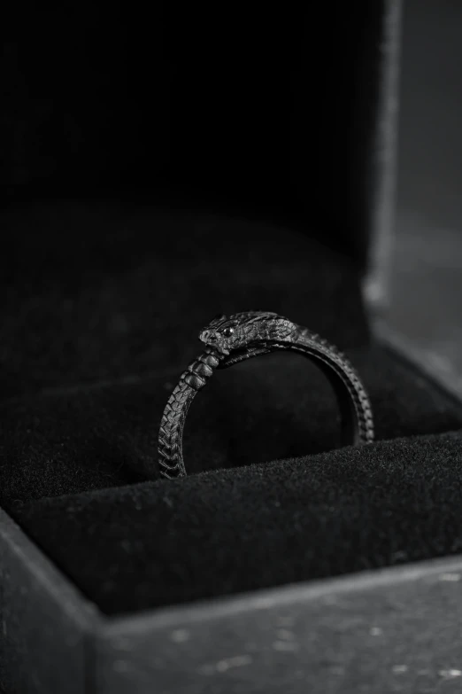 a ring in a box on top of the floor