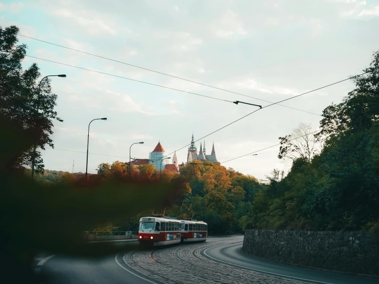 an old double decker bus passing by on a road