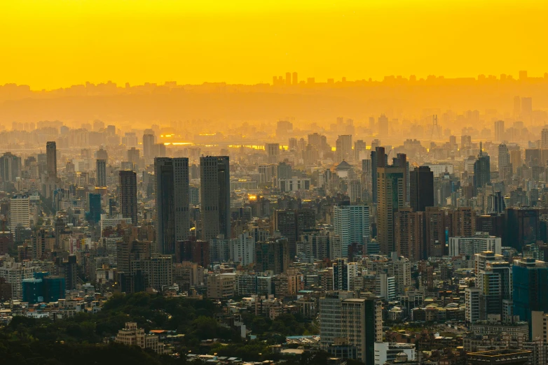 a picture taken at dusk from atop of a city