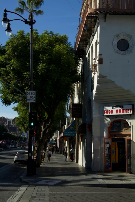 a street filled with shops and a traffic light