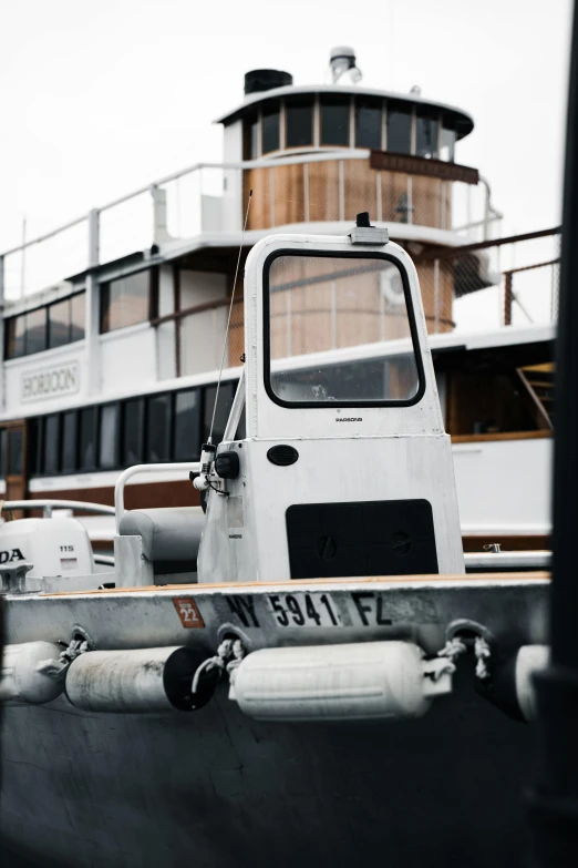 the white boat has a large brown tower