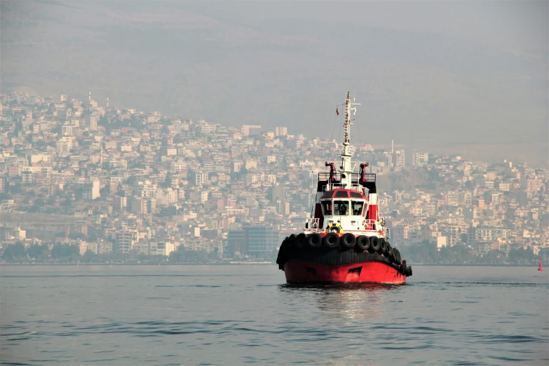 a tug boat that is out on the water