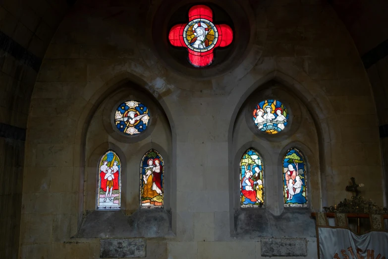 a large stained glass window inside of a building