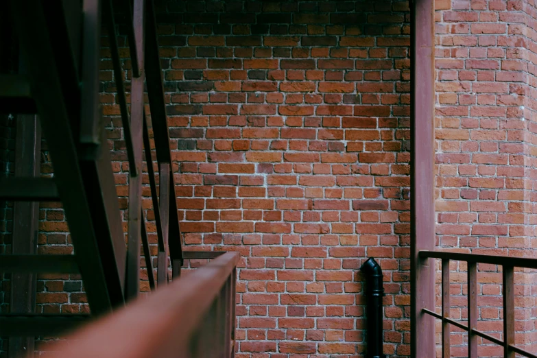 stairs to a brick building next to a stairway