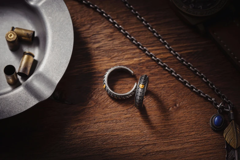 there is a ring, and two other jewelry pieces on the table