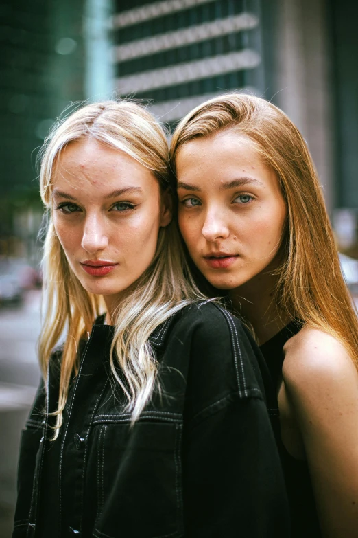 two beautiful women are posing together for the camera