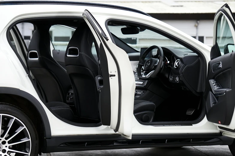 the front doors of a car with its hatch open