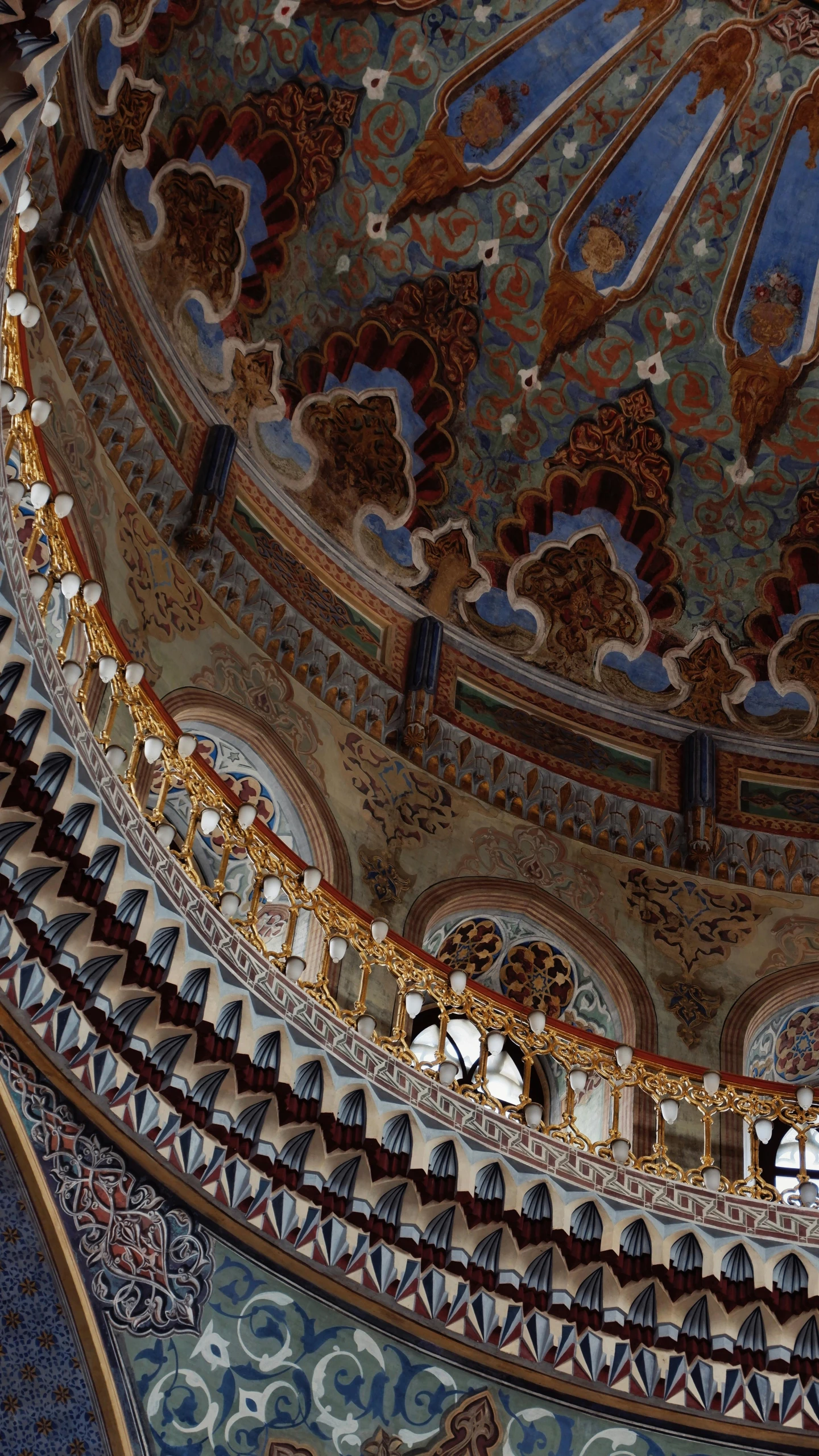 an ornate dome with decorative designs in the ceiling