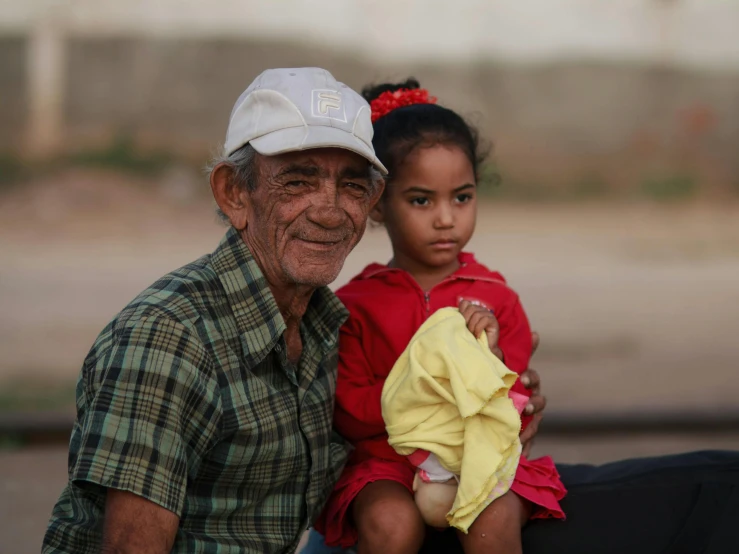 an old man and a  sitting close together