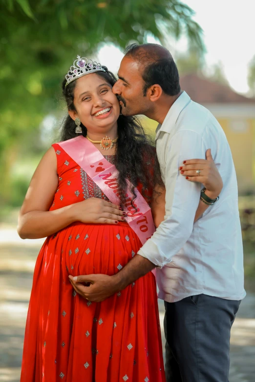 a man and woman standing close together and kissing