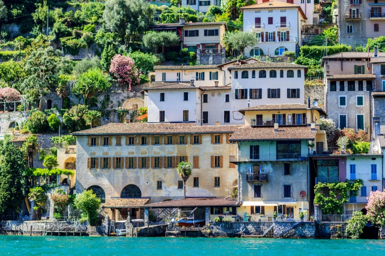 a city with lots of houses is on the side of a mountain