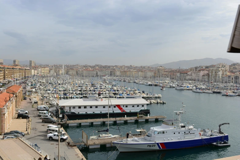 the boat is docked near the city harbor