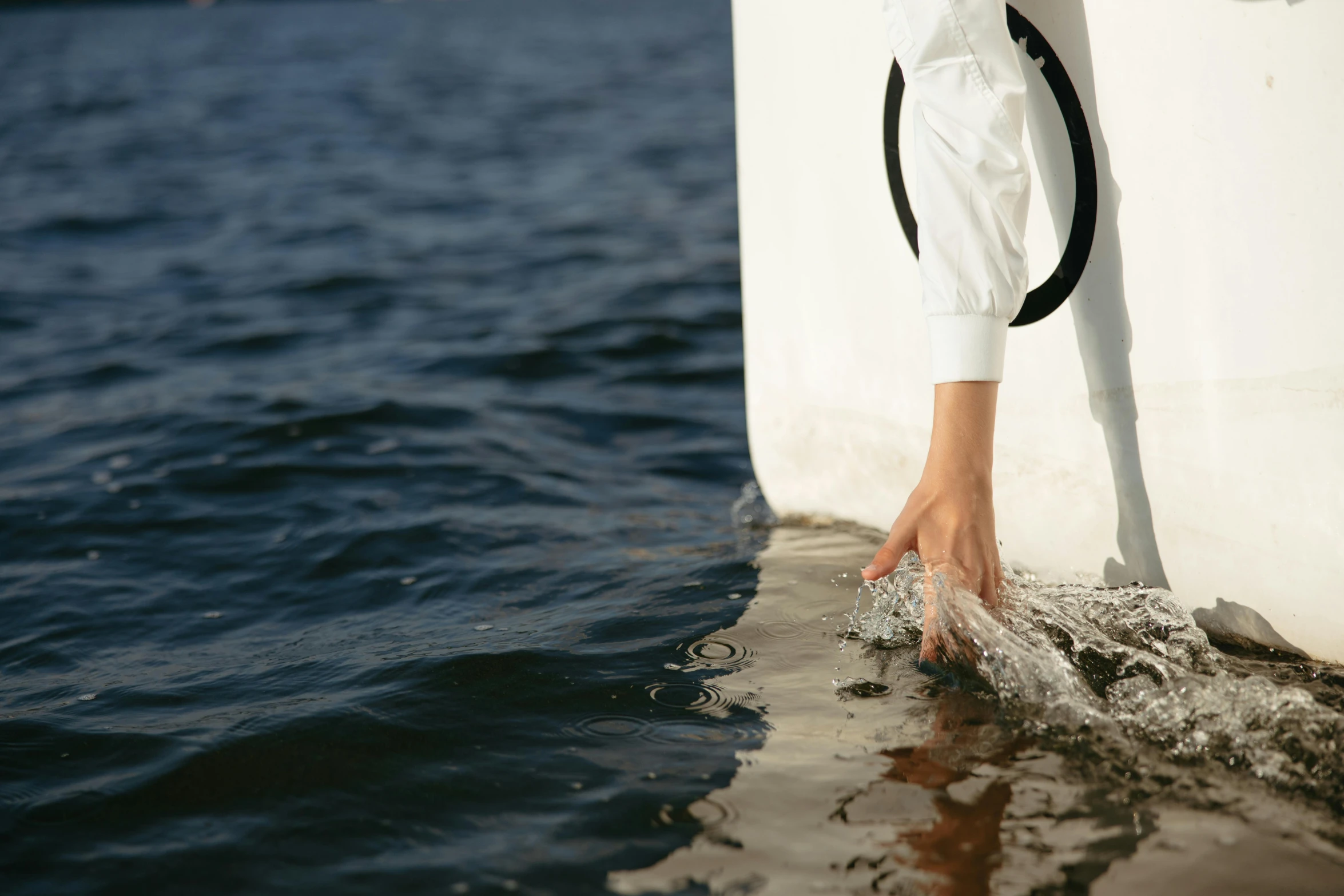 a person reaching for soing in the water