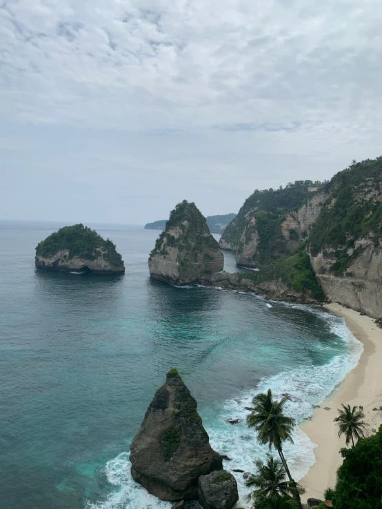 an aerial s of a beach near a cliff