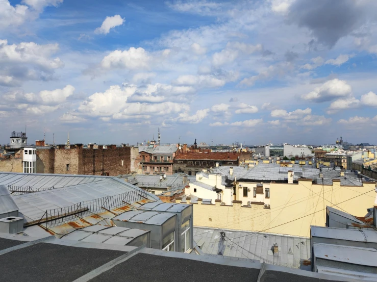 a cityscape with a very cloudy sky over it