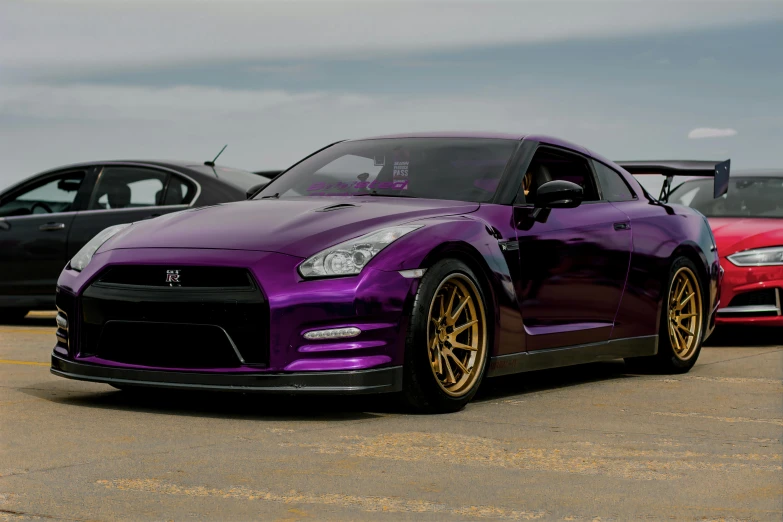 a purple nissan sports car parked in a parking lot