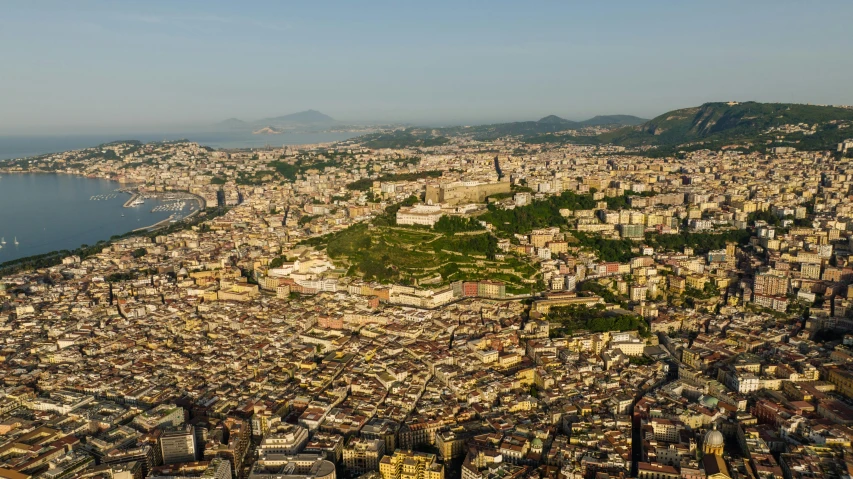 an aerial view of a city with lake