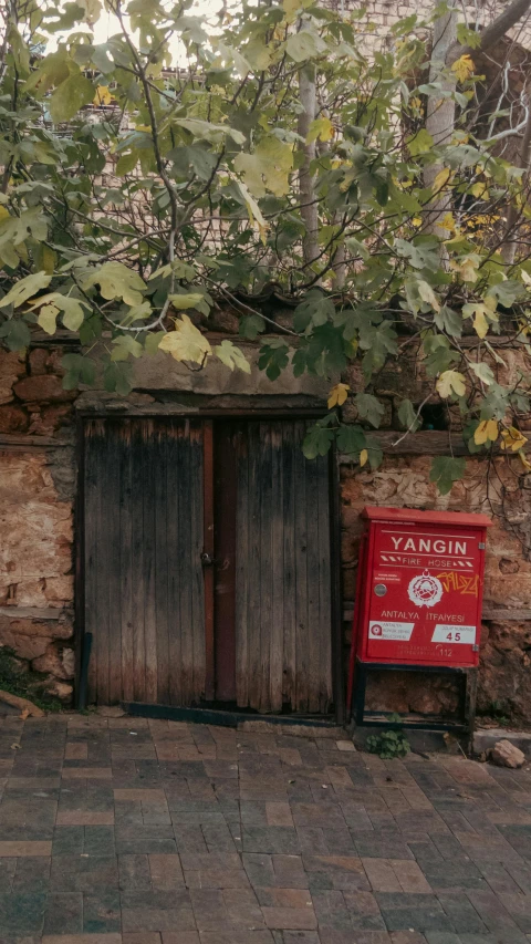 a pair of doors with a sign sitting outside the building