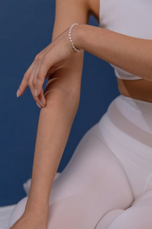 a woman with a ring on her left arm