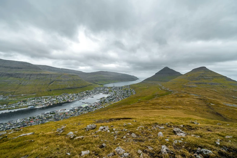 looking down on a mountain from a top of a hill